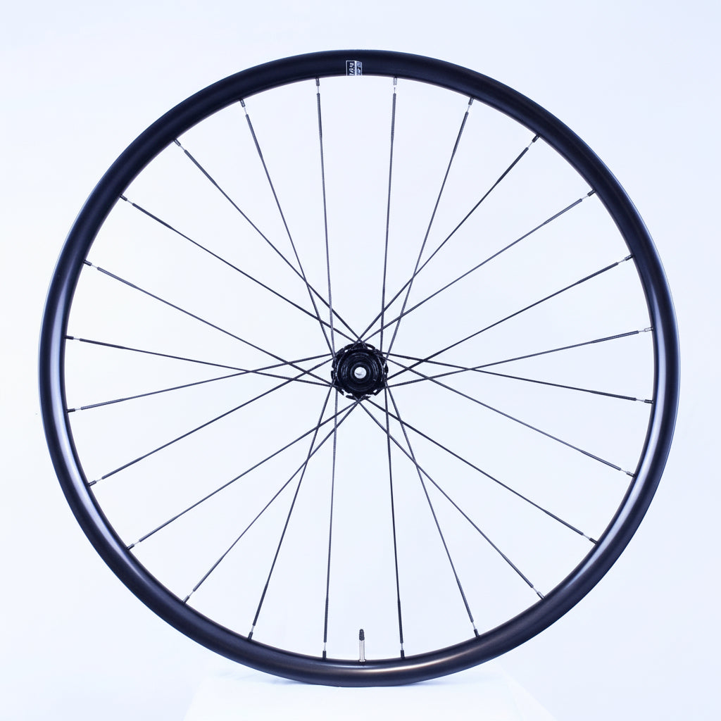 Bicycle wheel with black rim and spokes on a white background