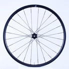 Bicycle wheel with black rim and spokes on a white background