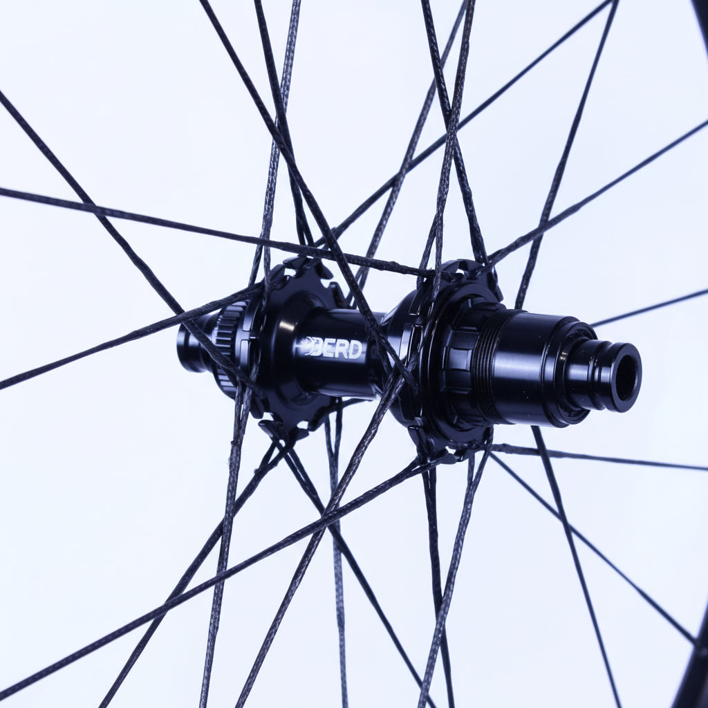 Close-up of a bicycle hub with 'BERD' branding on a white background