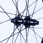 Close-up of a bicycle hub with 'BERD' branding on a white background